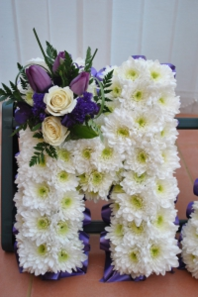 Single Funeral Letter - The florist will create an arrangement to spell out your word. Colours can be requested, please leave any request's in the request box, or contact the florist direct. Each letter cost £25 each.