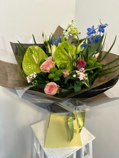 Garden Brights - A cheerful bouquet combining lively pinks, fresh greens and vibrant blue accents for a colourful, uplifting finish.