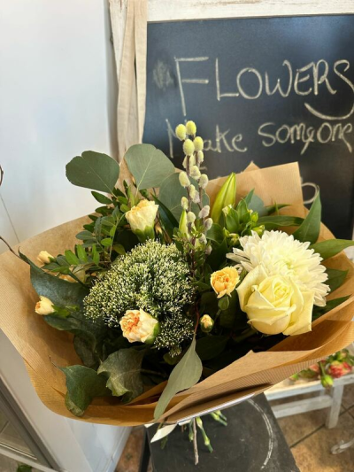 Freshly Wrapped - A natural flower wrap featuring soft whites and creams with fresh green foliage and delicate pops of colour.