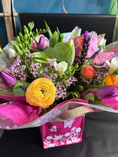 Colour Crush - A vibrant flower bag filled with bold pinks, sunny yellows and rich purples for a bright and cheerful display.